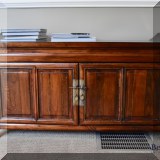F08. Low Asian-inspired cabinet. 26”h x 48”w x 17”d 
